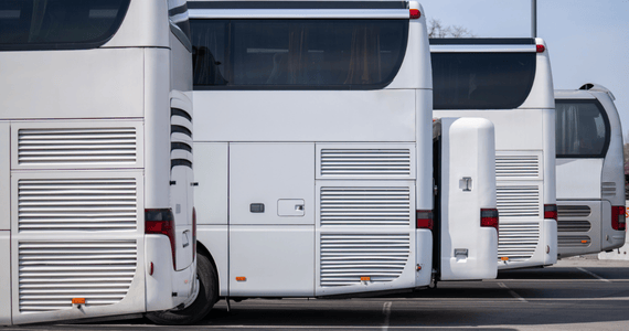 charter buses parked at a parking lot